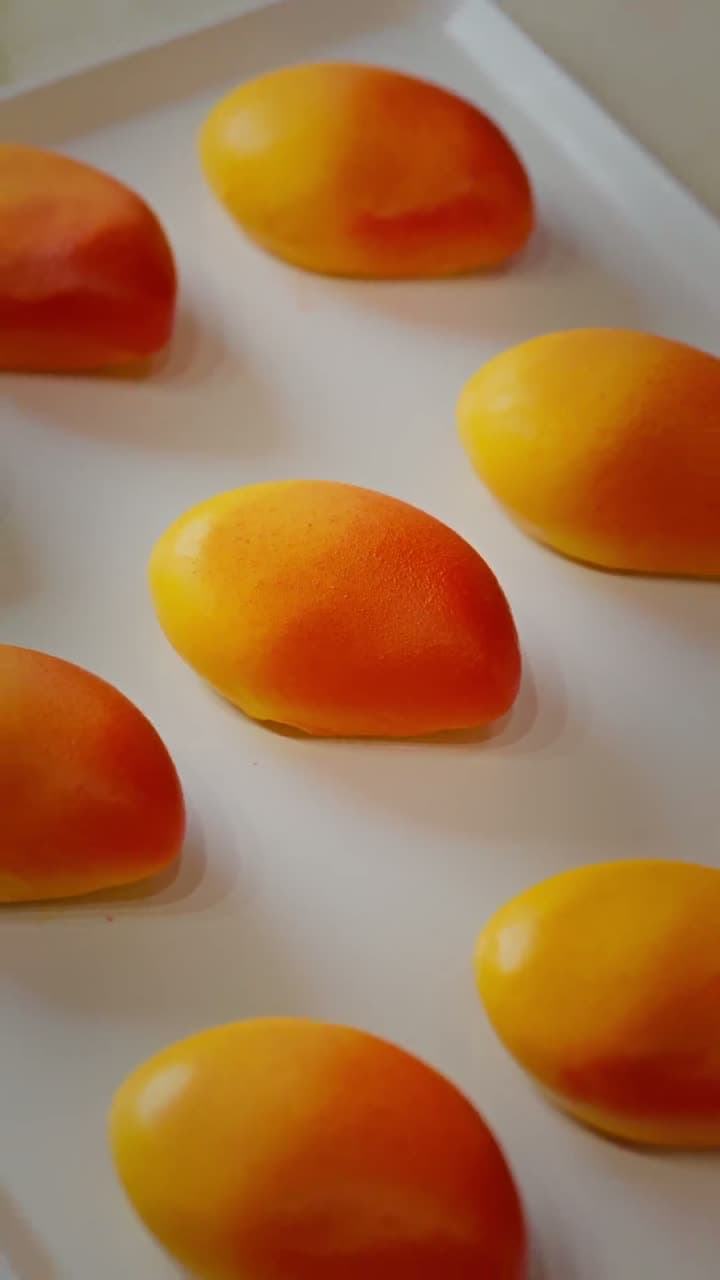 Rows of finished pastries on marble