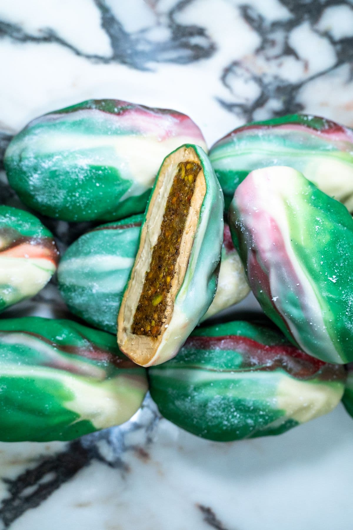 Pistacho broken open on marble